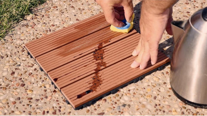 Cleaning greasy stains from decking tiles